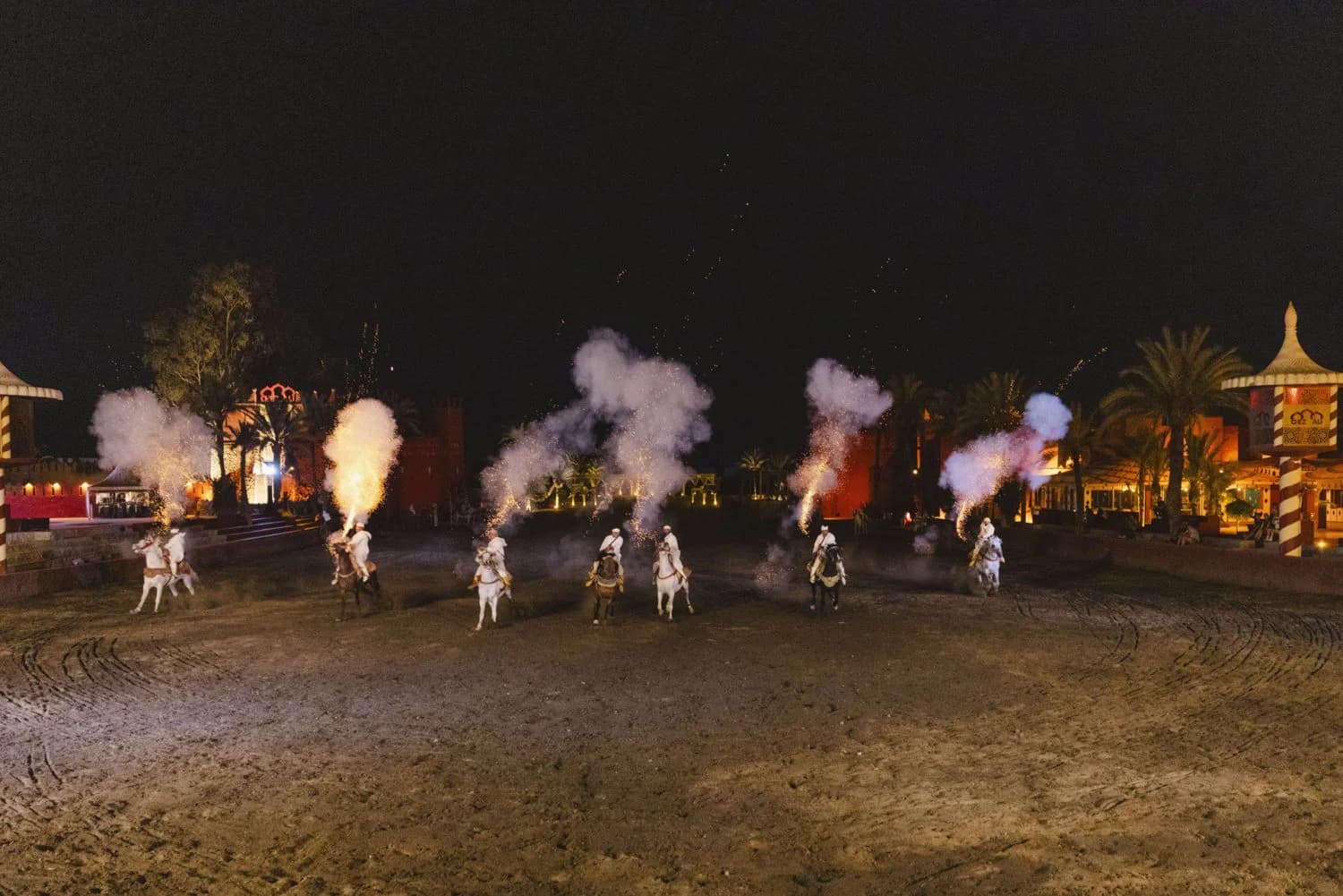 Dramatic equestrian fantasia and tbourida riders in full traditional dress