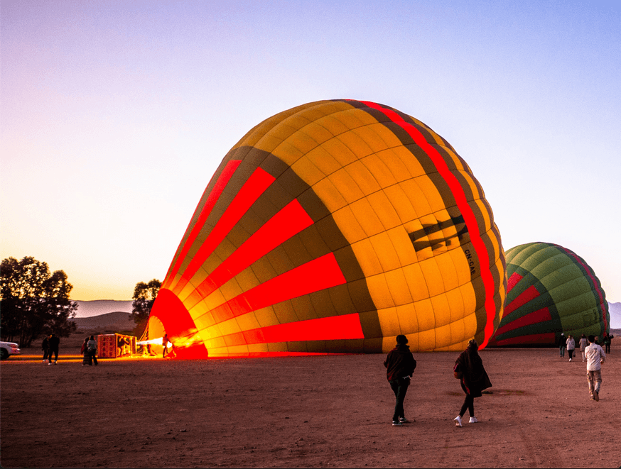 Colorful hot air balloon in flight against the morning sky